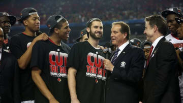 ATLANTA, GA - APRIL 08: Luke Hancock #11 (C) of the Louisville Cardinals is interviewed by CBS announcer Jim Nantz as he celebrates with teammates after they won 82-76 against the Michigan Wolverinesduring the 2013 NCAA Men's Final Four Championship at the Georgia Dome on April 8, 2013 in Atlanta, Georgia. (Photo by Streeter Lecka/Getty Images)
