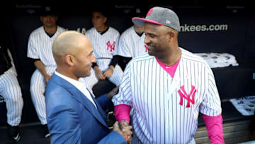 NEW YORK, NY - MAY 14: Former New York Yankees captain Derek Jeter greets former teammate CC Sabathia #52 in the dugout during Derek Jeter number retirement cerremony at Yankee Stadium on May 14, 2017 in the Bronx borough of New York City. (Photo by Elsa/Getty Images)