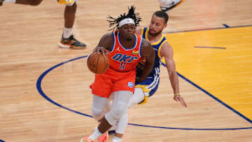 OKC Thunder guard Luguentz Dort (5) is fouled by Golden State Warriors guard Stephen Curry (30): Cary Edmondson-USA TODAY Sports