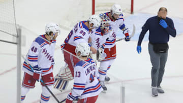 Mar 4, 2021; Newark, New Jersey, USA; New York Rangers goaltender Igor Shesterkin (31) is helped off the ice during the third period of their game against the New Jersey Devils at Prudential Center. Mandatory Credit: Ed Mulholland-USA TODAY Sports