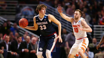 Mar 25, 2016; Chicago, IL, USA; Gonzaga Bulldogs forward Kyle Wiltjer (33) is defended by Syracuse Orange guard Trevor Cooney (10) during the first half in a semifinal game in the Midwest regional of the NCAA Tournament at United Center. Mandatory Credit: Dennis Wierzbicki-USA TODAY Sports