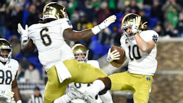 DURHAM, NORTH CAROLINA - NOVEMBER 09: Chris Finke #10 celebrates with Tony Jones Jr. #6 of the Notre Dame Fighting Irish after scoring a touchdown against the Duke Blue Devils during the first quarter of their game at Wallace Wade Stadium on November 09, 2019 in Durham, North Carolina. (Photo by Grant Halverson/Getty Images)