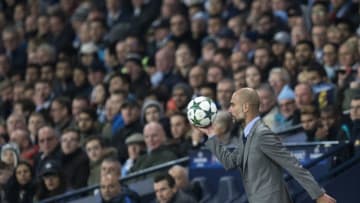 TOPSHOT - Manchester City's Spanish manager Pep Guardiola retrieves the ball during the UEFA Champions League group C football match between Manchester City and Barcelona at the Etihad Stadium in Manchester, north west England on November 1, 2016. / AFP / OLI SCARFF (Photo credit should read OLI SCARFF/AFP/Getty Images)