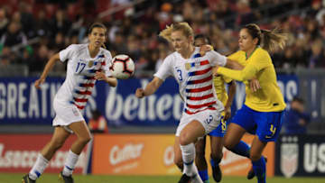 TAMPA, FLORIDA - MARCH 05: Samantha Mewis #3 of the USA looks to pass the ball over Erika #4 of Brazil in the first half during the She Believes Cupat Raymond James Stadium on March 05, 2019 in Tampa, Florida. (Photo by Mike Ehrmann/Getty Images)