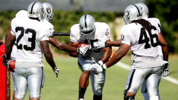 NAPA, CA - AUGUST 05: Marcel Reece #45 runs with the ball during the Oakland Raiders Training Camp at the Napa Valley Marriott on August 5, 2009 in Napa, California. (Photo by Jed Jacobsohn/Getty Images)