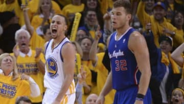 Apr 27, 2014; Oakland, CA, USA; Golden State Warriors guard Stephen Curry (30) celebrates after blocking the shot of Los Angeles Clippers guard J.J. Redick (4, not pictured) during the fourth quarter in game four of the first round of the 2014 NBA Playoffs at Oracle Arena. The Warriors defeated the Clippers 118-97. Mandatory Credit: Kyle Terada-USA TODAY Sports