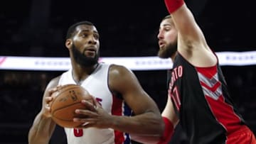 Mar 24, 2015; Auburn Hills, MI, USA; Detroit Pistons center Andre Drummond (0) looks to pass the ball as Toronto Raptors center Jonas Valanciunas (17) defends during the third quarter at The Palace of Auburn Hills. The Pistons won 108-104. Mandatory Credit: Raj Mehta-USA TODAY Sports