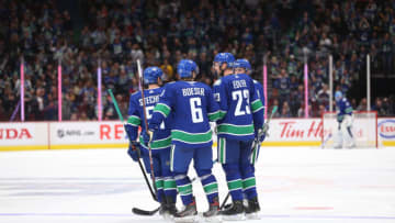 VANCOUVER, BC - OCTOBER 09: Alexander Edler #23 of the Vancouver Canucks celebrates his goal against the Los Angeles Kings with teammates Troy Stetcher #51, Brock Boeser #6 and J.T Miller #9 during the third period at Rogers Arena on October 9, 2019 in Vancouver, Canada. (Photo by Ben Nelms/Getty Images)