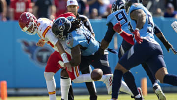 NASHVILLE, TENNESSEE - OCTOBER 24: Patrick Mahomes #15 of the Kansas City Chiefs has the ball stripped by Bud Dupree #48 of the Tennessee Titans at Nissan Stadium on October 24, 2021 in Nashville, Tennessee. The Titans defeated the Chiefs 27-3. (Photo by Wesley Hitt/Getty Images)