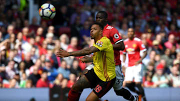 MANCHESTER, ENGLAND - MAY 13: Andre Gray of Watford and Eric Bailly of Manchester United in action during the Premier League match between Manchester United and Watford at Old Trafford on May 13, 2018 in Manchester, England. (Photo by Ross Kinnaird/Getty Images)