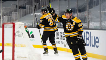 Apr 1, 2021; Boston, Massachusetts, USA; Boston Bruins forward Brad Marchand (63) celebrates after scoring a goal against the Pittsburgh Penguins in the third period at TD Garden. Mandatory Credit: Kathryn Riley-USA TODAY Sports