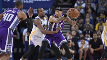OAKLAND, CA - FEBRUARY 15: Willie Cauley-Stein #00 of the Sacramento Kings looks to pass the ball while guarded by Kevin Durant #35 of the Golden State Warriors during an NBA Basketball game at ORACLE Arena on February 15, 2017 in Oakland, California. NOTE TO USER: User expressly acknowledges and agrees that, by downloading and or using this photograph, User is consenting to the terms and conditions of the Getty Images License Agreement. (Photo by Thearon W. Henderson/Getty Images)