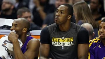 Mar 15, 2013; Indianapolis, IN, USA; Los Angeles Lakers guard Kobe Bryant (24) and center Dwight Howard (12) watch from the bench during a game against the Indiana Pacers at Bankers Life Fieldhouse. Los Angeles Lakers defeated the Indiana Pacers 99-93. Mandatory Credit: Brian Spurlock-USA TODAY Sports