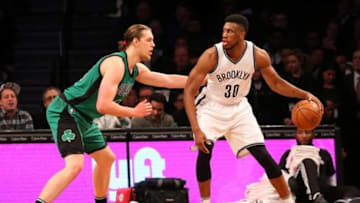 Jan 4, 2016; Brooklyn, NY, USA; Boston Celtics center Kelly Olynyk (41) defends Brooklyn Nets forward Thaddeus Young (30) during the third quarter at Barclays Center. Boston Celtics won 103-94. Mandatory Credit: Anthony Gruppuso-USA TODAY Sports