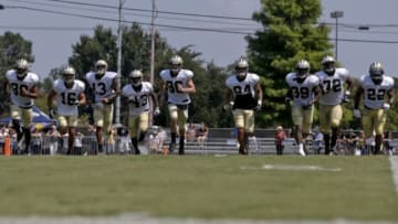 Jul 29, 2013; Metairie, LA, USA; New Orleans Saints players run sprints at the end of a morning training camp practice at the team facility. Mandatory Credit: Derick E. Hingle-USA TODAY Sports