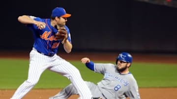 Nov 1, 2015; New York City, NY, USA; New York Mets second baseman Daniel Murphy (28) forces out Kansas City Royals third baseman Mike Moustakas (8) on a fielder