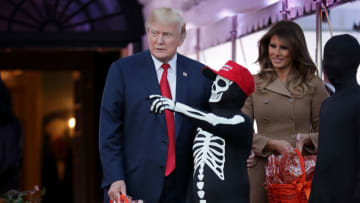 WASHINGTON, DC - OCTOBER 30: U.S. President Donald Trump (L) and first lady Melania Trump host Halloween at the White House on the South Lawn October 30, 2017 in Washington, DC. The first couple gave cookies away to costumed trick-or-treaters one day before the Halloween holiday. (Photo by Chip Somodevilla/Getty Images)