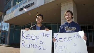 Jan 12, 2016; Houston, TX, USA; St Louis Rams fans hold signs while owners meet at the 2016 NFL owners meeting at the Westin Houston. Mandatory Credit: Thomas B. Shea-USA TODAY Sports