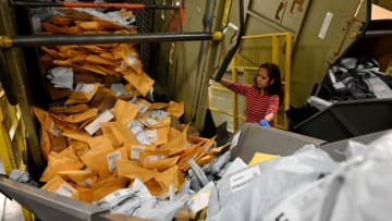 LOS ANGELES, CA- DECEMBER 12: Marianne Isaac works to help sort over 7000 pieces of mail on a small parcel sorter system machine during a behind the scenes tour at the USPS Distribution Center on Wednesday, December 12, 2018 in the City of Industry, California. (Photo by Keith Birmingham/Digital First Media/Pasadena Star-News via Getty Images)