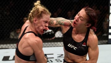 LAS VEGAS, NV - DECEMBER 30: (R-L) Cris Cyborg of Brazil punches Holly Holm in their women's featherweight bout during the UFC 219 event inside T-Mobile Arena on December 30, 2017 in Las Vegas, Nevada. (Photo by Jeff Bottari/Zuffa LLC/Zuffa LLC via Getty Images)