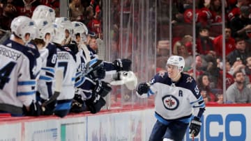Fantasy Hockey: NEWARK, NEW JERSEY - DECEMBER 01: Mark Scheifele #55 of the Winnipeg Jets celebrates his goal with teammates on the bench in the second period against the New Jersey Devils at Prudential Center on December 01, 2018 in Newark, New Jersey. (Photo by Elsa/Getty Images)