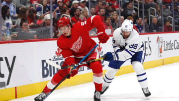 Sep 27, 2019; Detroit, MI, USA; Detroit Red Wings defenseman Moritz Seider (53) and Toronto Maple Leafs left wing Rich Clunr (39) battle for the puck in the third period at Little Caesars Arena. Mandatory Credit: Rick Osentoski-USA TODAY Sports