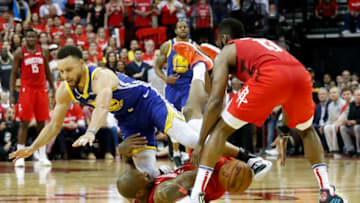 HOUSTON, TX - MAY 04: PJ Tucker #17 of the Houston Rockets andStephen Curry #30 of the Golden State Warriors battle for a loose ball in the fourth quarter during Game Three of the Second Round of the 2019 NBA Western Conference Playoffs at Toyota Center on May 4, 2019 in Houston, Texas. NOTE TO USER: User expressly acknowledges and agrees that, by downloading and or using this photograph, User is consenting to the terms and conditions of the Getty Images License Agreement. (Photo by Tim Warner/Getty Images)