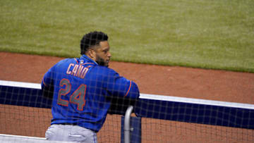 MIAMI, FLORIDA - AUGUST 18: Robinson Cano #24 of the New York Mets looks on from the dugout during the game against the Miami Marlins at Marlins Park on August 18, 2020 in Miami, Florida. (Photo by Mark Brown/Getty Images)
