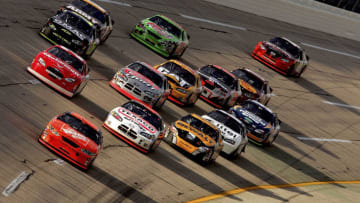 TALLADEGA, AL - OCTOBER 2: Tony Stewart, driver of the #20 Home Depot Chevrolet, leads the pack during the NASCAR Nextel Cup Series UAW Ford 500 on October 2, 2005 at Talladega Superspeedway in Talladega, Alabama. (Photo by Matthew Stockman/Getty Images)