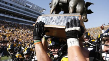 IOWA CITY, IA - SEPTEMBER 29: Iowa Hawkeyes players carry the Floyd of Rosedale trophy off the field after the game against the Minnesota Golden Gophers at Kinnick Stadium on September 29, 2012 in Iowa City, Iowa. Iowa won 31-13. (Photo by Joe Robbins/Getty Images)