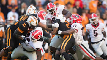 Tennessee running back Jabari Small is tackled during an SEC football homecoming game between the Tennessee Volunteers and the Georgia Bulldogs in Neyland Stadium in Knoxville on Saturday, Nov. 13, 2021.(Photo by The Knoxville News Sentinel)