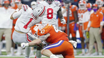 Ohio State Buckeyes quarterback Justin Fields (1) gets hit by Clemson Tigers linebacker James Skalski (47) in the second quarter during the College Football Playoff semifinal at the Allstate Sugar Bowl in the Mercedes-Benz Superdome in New Orleans on Friday, Jan. 1, 2021. Skalski was called for targeting on the play and kicked out of the game.College Football Playoff Ohio State Faces Clemson In Sugar Bowl