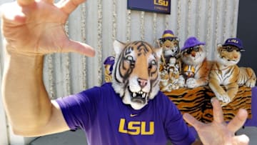 Sep 19, 2015; Baton Rouge, LA, USA; LSU fan Wayne Broussard with his tigers during tailgating before the game between Louisiana State and Auburn at Tiger Stadium. Mandatory Credit: Erich Schlegel-USA TODAY Sports