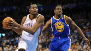 Jan 17, 2014; Oklahoma City, OK, USA; Oklahoma City Thunder small forward Kevin Durant (35) drives the ball to the basket against Golden State Warriors guard Jordan Crawford (55) at Chesapeake Energy Arena. Mandatory Credit: Mark D. Smith-USA TODAY Sports