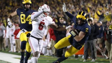 ANN ARBOR, MI - OCTOBER 13: Shea Patterson #2 of the Michigan Wolverines is knocked out of bounds after a long first half run by Rachad Wildgoose #5 of the Wisconsin Badgers on October 13, 2018 at Michigan Stadium in Ann Arbor, Michigan. (Photo by Gregory Shamus/Getty Images)