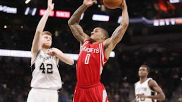 Oct 21, 2016; San Antonio, TX, USA; Houston Rockets point guard Gary Payton II (0) prepares to dunk the ball as San Antonio Spurs small forward Davis Bertans (42) defends during the second half at AT&T Center. The Spurs won 114-99. Mandatory Credit: Soobum Im-USA TODAY Sports