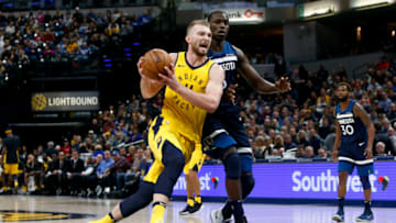 INDIANAPOLIS, IN - DECEMBER 31: Domantas Sabonis #11 of the Indiana Pacers drives to the basket against Gorgui Dieng #5 of the Minnesota Timberwolves during the second half at Bankers Life Fieldhouse on December 31, 2017 in Indianapolis, Indiana. NOTE TO USER: User expressly acknowledges and agrees that, by downloading and or using this photograph, User is consenting to the terms and conditions of the Getty Images License Agreement. (Photo by Michael Reaves/Getty Images)