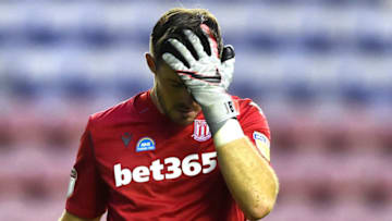 WIGAN, ENGLAND - JUNE 30: Jack Butland of Stoke City looks dejected during the Sky Bet Championship match between Wigan Athletic and Stoke City at DW Stadium on June 30, 2020 in Wigan, England. (Photo by Nathan Stirk/Getty Images)