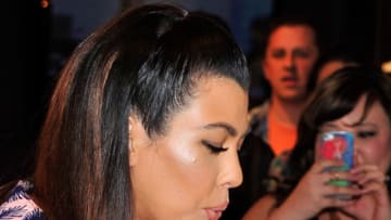 LAS VEGAS, NV - APRIL 12: Television personality Kourtney Kardashian receives a birthday cupcake as she arrives at the Kardashian Khaos store at The Mirage Hotel & Casino for a fan meet-and-greet on April 12, 2014 in Las Vegas, Nevada. (Photo by David Becker/Getty Images)