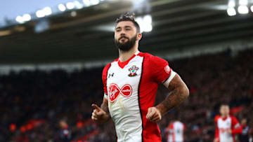 SOUTHAMPTON, ENGLAND - DECEMBER 23: Charlie Austin of Southampton celebrates after scoring his sides first goal during the Premier League match between Southampton and Huddersfield Town at St Mary's Stadium on December 23, 2017 in Southampton, England. (Photo by Clive Rose/Getty Images)