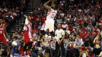 Nov 27, 2015; Houston, TX, USA; Houston Rockets shooting guard James Harden (13) shoots the ball over Philadelphia 76ers small forward Robert Covington (L) during the second half at Toyota Center. Mandatory Credit: Soobum Im-USA TODAY Sports