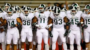 PISCATAWAY, NJ - OCTOBER 10: The Michigan State Spartans take the field for warm ups before the game against the Rutgers Scarlet Knights on October 10, 2015 at High Point Solutions Stadium in Piscataway, New Jersey. (Photo by Elsa/Getty Images)