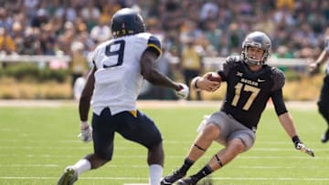 Oct 17, 2015; Waco, TX, USA; Baylor Bears quarterback Seth Russell (17) slides in front of West Virginia Mountaineers safety KJ Dillon (9) during the second quarter at McLane Stadium. Mandatory Credit: Jerome Miron-USA TODAY Sports