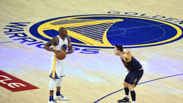 Jun 2, 2016; Oakland, CA, USA; Golden State Warriors forward Andre Iguodala (9) handles the ball against Cleveland Cavaliers guard Matthew Dellavedova (8) during the third quarter in game one of the NBA Finals at Oracle Arena. Mandatory Credit: Kyle Terada-USA TODAY Sports