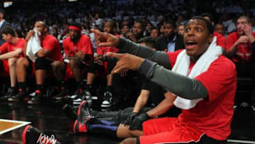 May 2, 2014; Brooklyn, NY, USA; Toronto Raptors point guard Kyle Lowry (7) calls out to a teammate from the bench during the second quarter of game six of the first round of the 2014 NBA Playoffs against the Brooklyn Nets at Barclays Center. Mandatory Credit: Brad Penner-USA TODAY Sports