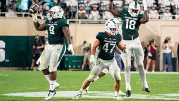 EAST LANSING, MI - SEPTEMBER 02: Simeon Barrow #8 of Michigan State celebrates his fumble recovery late in the second quarter against Western Michigan with teammates Jeff Pietrowski #47 and Zion Young #18 at Spartan Stadium on September 2, 2022 in East Lansing, Michigan. (Photo by Jaime Crawford/Getty Images)