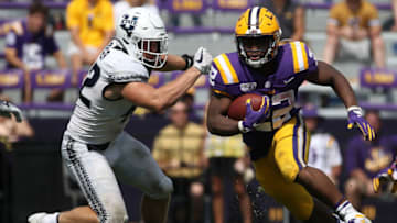 BATON ROUGE, LOUISIANA - OCTOBER 05: Running back Clyde Edwards-Helaire #22 of the LSU Tigers runs with the ball against the Utah State Aggies at Tiger Stadium on October 05, 2019 in Baton Rouge, Louisiana. (Photo by Chris Graythen/Getty Images)