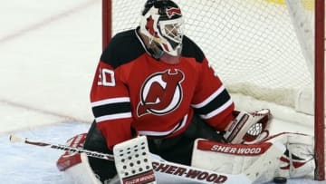 Apr 7; Newark, NJ, USA; New Jersey Devils goalie Martin Brodeur (30) makes a save during the third period against the Ottawa Senators at the Prudential Center. The Devils defeated the Senators 4-2. Mandatory Credit: Ed Mulholland-USA TODAY Sports