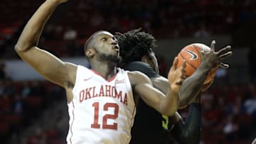 Dec 30, 2016; Norman, OK, USA; Oklahoma Sooners forward Khadeem Lattin (12) and Baylor Bears forward Johnathan Motley (5) fight for a rebound during the second half at Lloyd Noble Center. Mandatory Credit: Mark D. Smith-USA TODAY Sports
