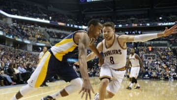 Feb 27, 2015; Indianapolis, IN, USA; Indiana Pacers guard George Hill (3) drives to the basket against Cleveland Cavaliers guard Matthew Dellavedova (8) at Bankers Life Fieldhouse. Indiana defeats Cleveland 93-86. Mandatory Credit: Brian Spurlock-USA TODAY Sports